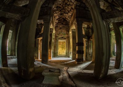Inside an empty temple made of stone in Cambodia with fisheye distorsion