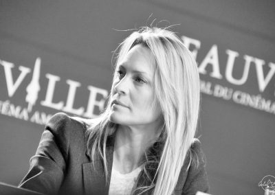 Black and white portrait of Robin Wright at a press conference