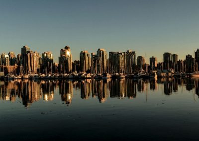 Skyline of buildings mirrored in the water